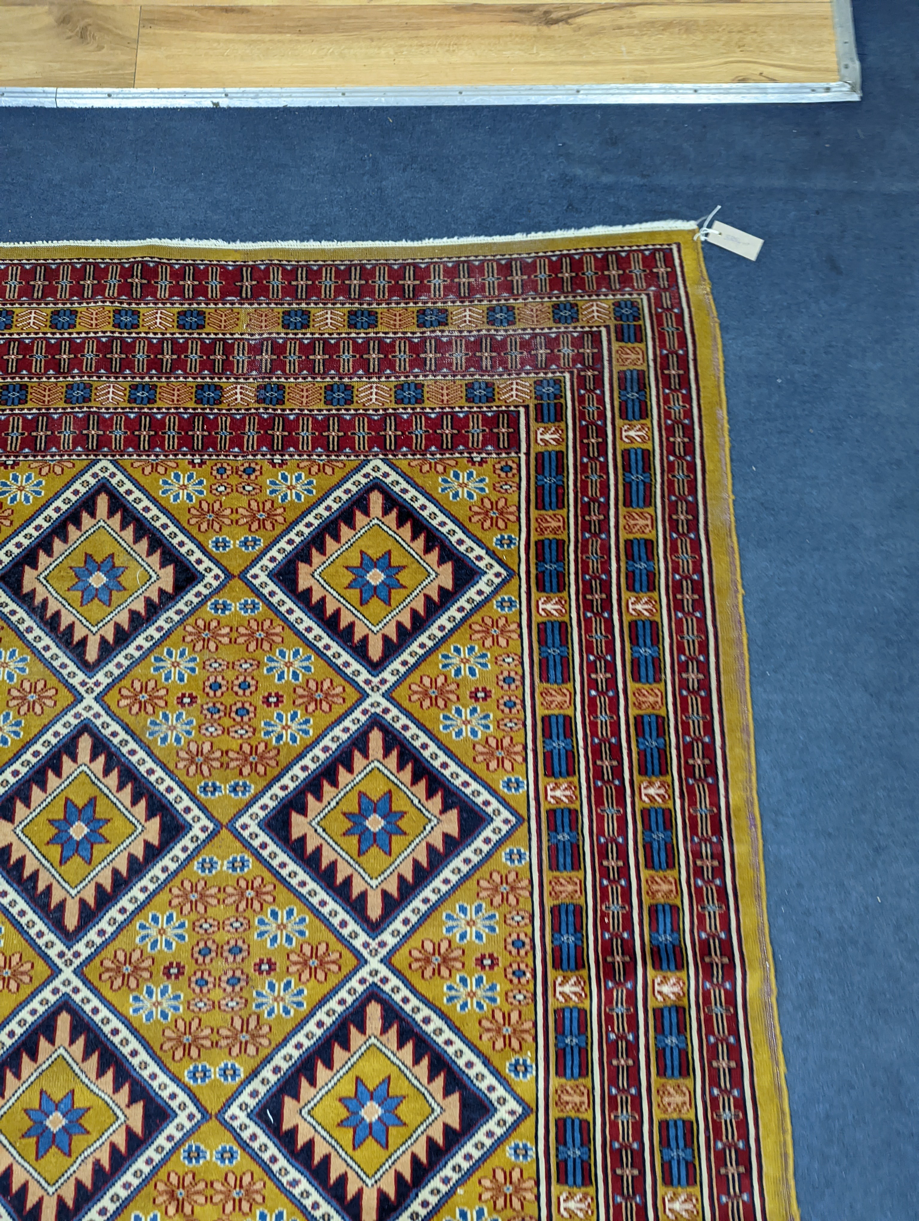 A Caucasian style gold ground rug, 190 x 124cm